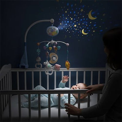 Mobile musical bébé avec figurines colorées suspendues au-dessus du lit et lumière douce