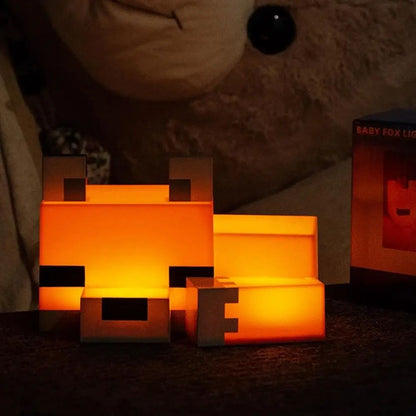 renard veilleuse LED en forme de renard diffusant une lumiere orange douce et chaleureuse