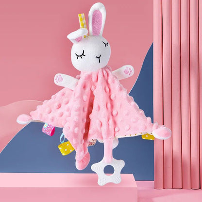 un doudou lapin rose texture est pose dans un berceau propre pret pour l heure du dodo